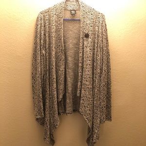 Long sleeve cream and black sweater.